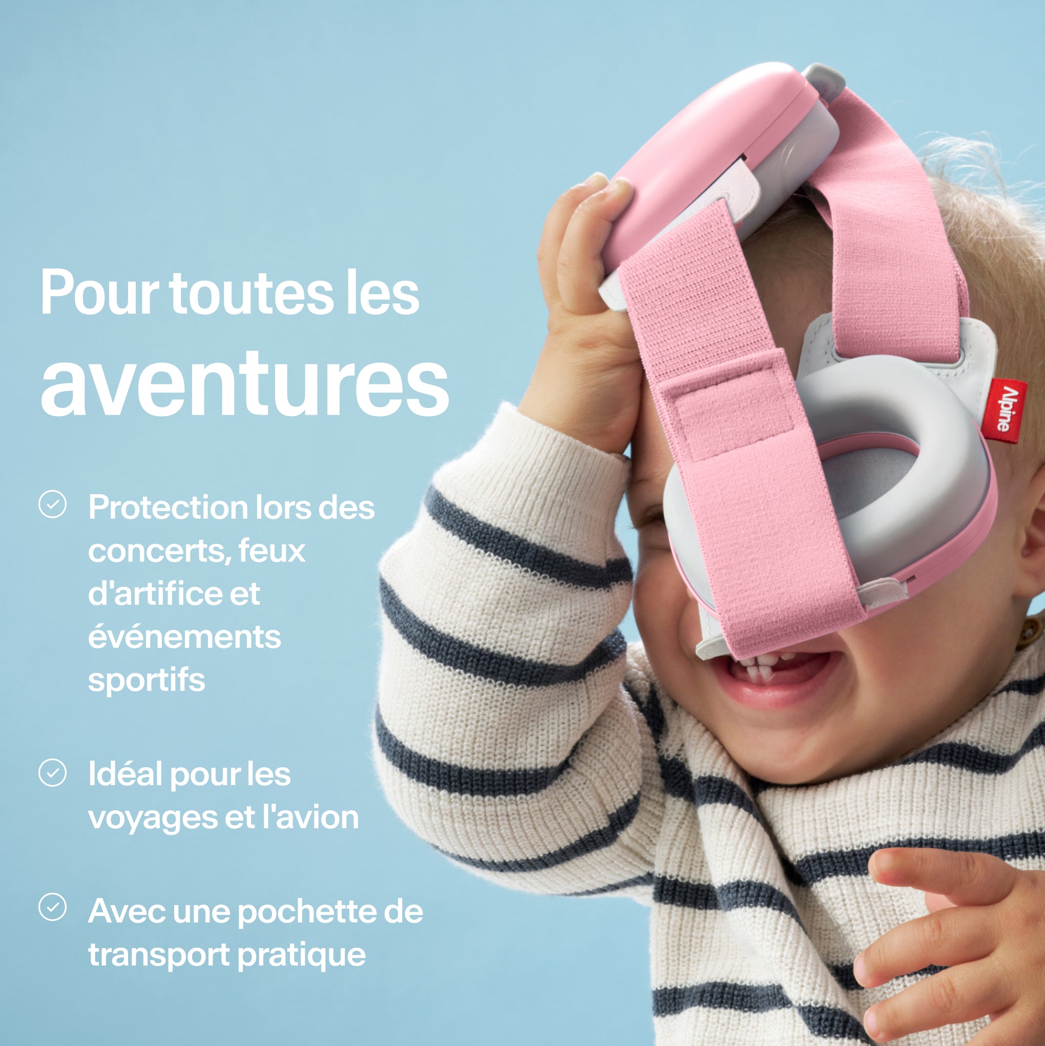 Bébé tenant Alpine Muffy Baby en rose pink en main avec USPs pour utilisation
