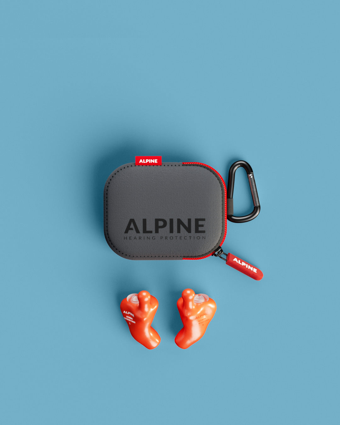 Vue d’ensemble des bouchons d’oreilles Alpine MusicSafe Sur Mesure 4D avec accessoires orange