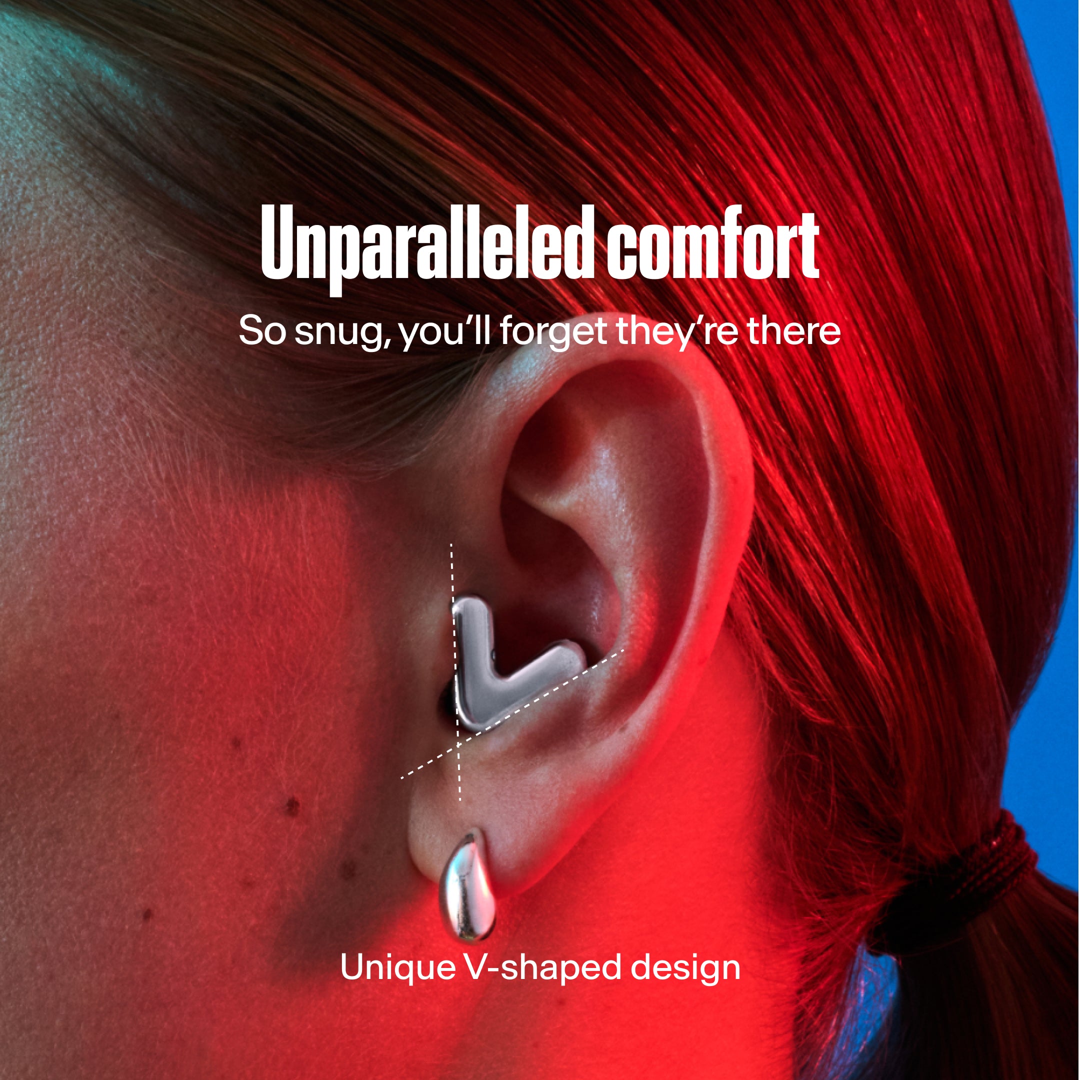 Detailed image of an ear with an Alpine Tune earplug in silver showing the snug fit in ear