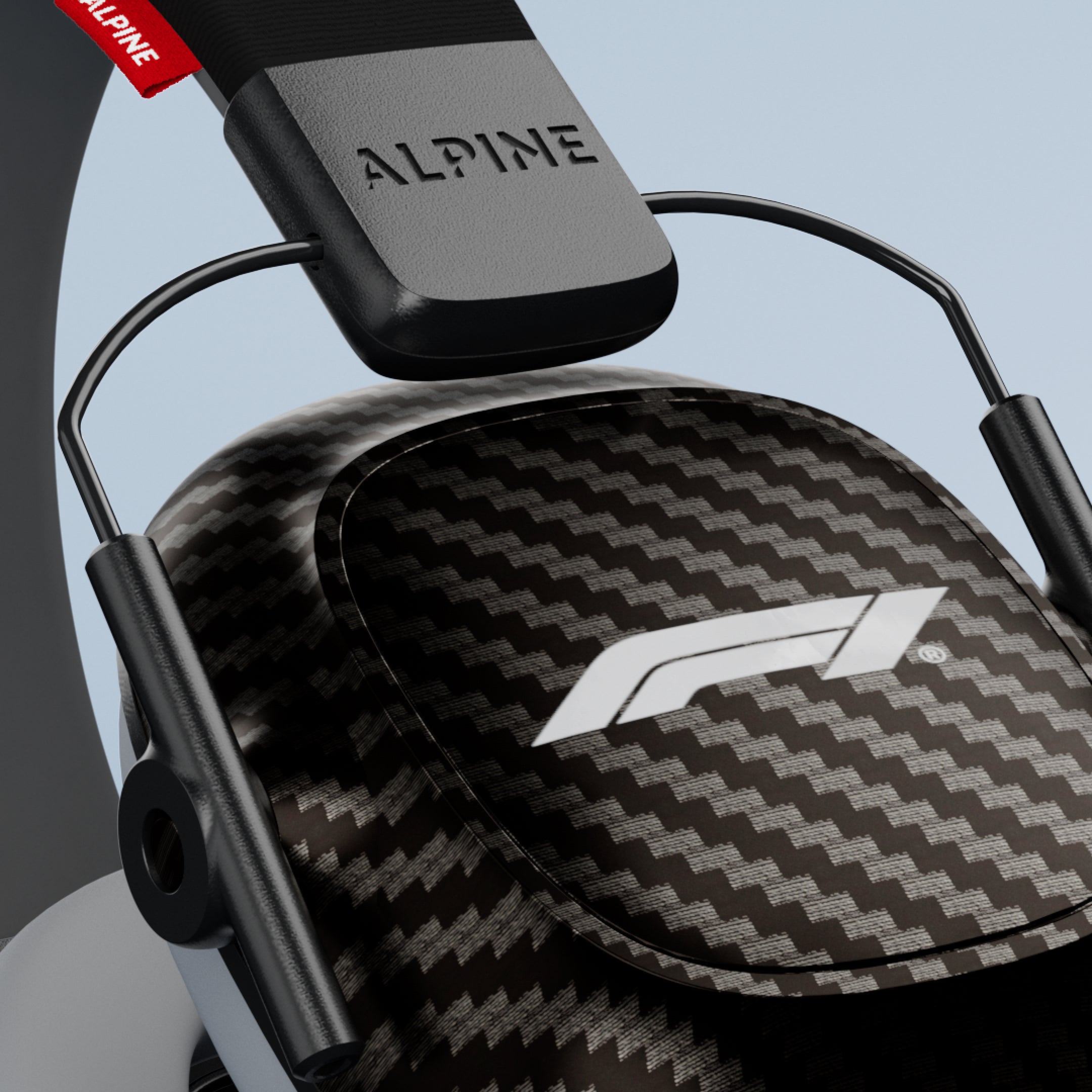 Close-up of an Alpine Formula 1 Racing Muffy ear cup with F1 logo and Alpine headband